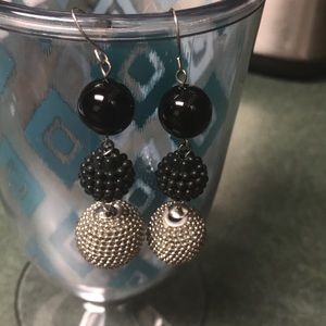 Black and silver dangly earrings.